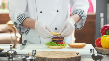 videoblocks-chef-making-a-tasty-burger-meat-egg-and-cheese_radxqpsfsf_thumbnail-full01